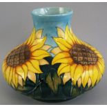 A Moorcroft vase, of flattened circular form, tube lined in the "Sun Flowers" pattern, 24cm