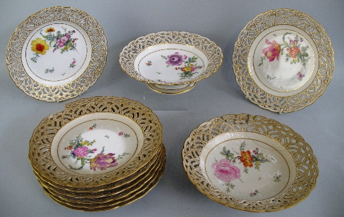 A Berlin dessert service, comprising a pair of tazzas and eight plates, each with a different floral