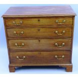 A George III mahogany chest, with moulded edged top over four long graduated drawers with brass swan