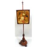 An early Victorian mahogany pole screen, with turned finial, rise and fall framed and glazed