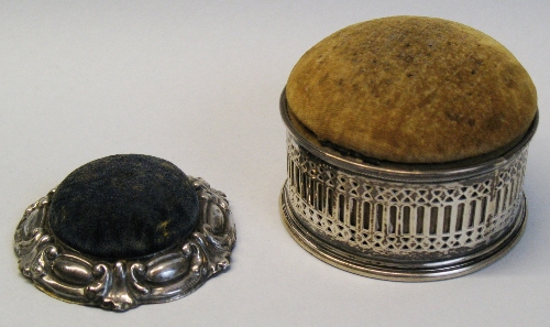 A Victorian box, of circular form with pierced tracery sides between moulded rims, the hinged