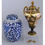 A Chinese ginger jar and cover, painted all over in blue and white with stylised flowerheads and