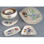 A Poole Pottery posy ring, 18.5cm diameter and four various sized Poole Pottery dishes each of a