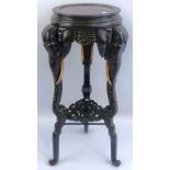 A Chinese ebonised jardiniere stand, the circular inset marble top with moulded rim, pierced key