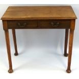 A 19th Century mahogany side table, with moulded edged oblong top over two frieze drawers with brass