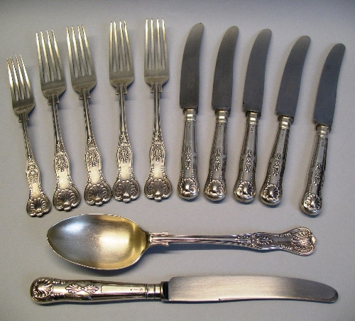 A set of four table forks, Kings pattern, Sheffield 1962, a matching table spoon, dessert fork and