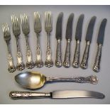 A set of four table forks, Kings pattern, Sheffield 1962, a matching table spoon, dessert fork and