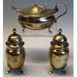 A Victorian three piece condiment set, the lozenge shaped bombe mustard pot with turned finial and