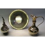 A continental white metal ewer and stand, the ewer of bottle shaped form with bulbous collar to