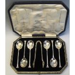 A set of six coffee spoons and matching sugar tongs, with oblong seal terminals, cased, Sheffield