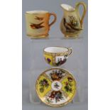 A Royal Worcester cabinet mug, painted with birds in flight on a blush ground, date code for 1904,