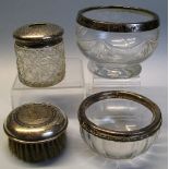 A clear glass bowl, of bulbous form cut with drapes and mounted with a silver rim, 11cm diameter,