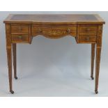 An Edwardian rosewood writing desk, with satinwood inlay, having leather writing surface over a