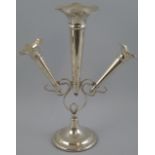 An Edwardian epergne, the Art Nouveau style open wire work frame supporting one large and two