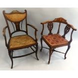 An Edwardian mahogany corner chair, with boxwood stringing, the shaped crest rail with inlaid