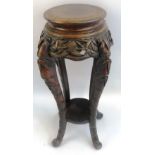 A late 19th/early 20th Century Chinese hardwood jardiniere stand, the circular top on concave