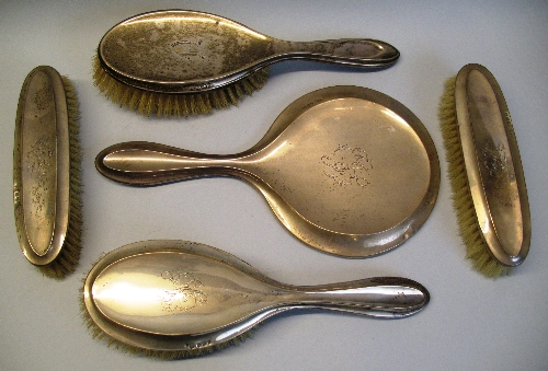 A matched five piece brush set, comprising pair of hair brushes, pair of clothes brushes and hand