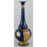 A Royal Doulton stoneware vase, of bottle shaped form with alternate fish scale and flowerhead