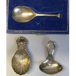 A caddy spoon, with flattened oblong haft and seal terminal, 9cm long, Birmingham 1928 in associated