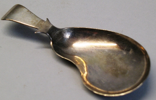 A George III caddy spoon, with kidney shaped bowl and short tapering haft, 8cm long, Birmingham