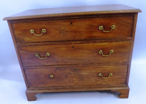 A George III mahogany chest, the moulded edged top over three long graduated cock beaded drawers