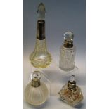 Four cut glass perfume bottles, with stoppers and silver mounts, comprising melon fluted globular,