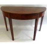 A 19th Century mahogany hall table, of semi circular form inlaid with boxwood and ebony to the