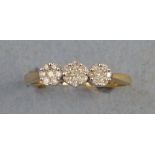 A diamond ring, comprising three flowerheads of seven diamonds set in row on 9ct gold shank, size R