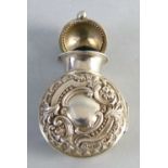 A Victorian chatelaine scent bottle holder, of flattened circular form, the hinged front and back