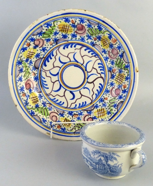 A 19th century pearlware child's chamber pot/vomit bowl, transfer printed in blue and white with a