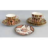 Royal Crown Derby in pattern 1128, two different size cups and saucers and two various tea plates (