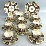 An early 20th century Crown Staffordshire tea-set, comprising two sandwich plates, eight of each