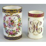 A Dresden cider tankard, of cylindrical form, painted with fighting trophies within a floral garland