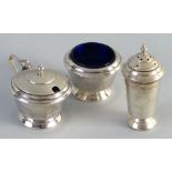 A three piece condiment set of Art Deco style, the mustard with hinged domed lid, stepped shoulders,