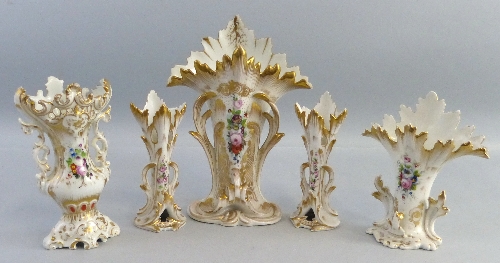 A matched garniture of three continental vases, each as tree trunks with flared tops and scrolling