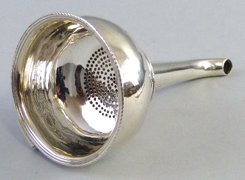 A George III wine funnel, with bulbous bowl and ring design to the tapering stem, London 1768, 2.