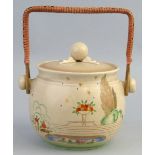 A Clarice Cliff Wilkinson Limited biscuit barrel and cover, shape No. 335, painted and enamelled