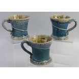 Walter Keeler, a set of three salt glazed stoneware mugs, each of waisted form with scrolling handle