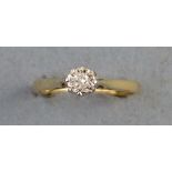 A solitaire diamond ring, with inset diamond on a 9ct gold shank, size L