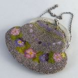 An Edwardian evening purse, the cut steel and coloured bead bag with pierced and embossed