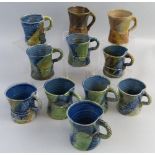 Jane Hamlyn, eleven various salt glazed stoneware mugs, all of waisted form, differing slightly in
