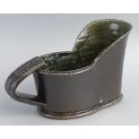 Walter Keeler, a salt glazed stoneware jug of hip bath shape with strap work handle and grey/green