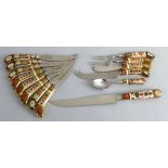 Royal Crown Derby in pattern 1128, eight various porcelain handled knives, a similar bread knife and