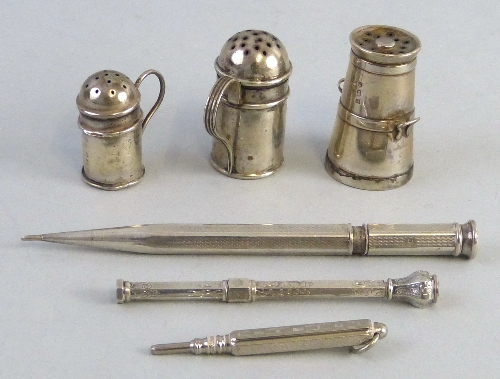 Three miniature pepperettes, one of churn shape and two as flour shakers, and three silver plated