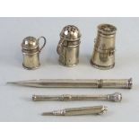 Three miniature pepperettes, one of churn shape and two as flour shakers, and three silver plated