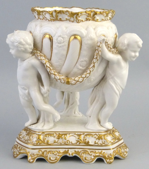 A Victorian Copeland table centrepiece, in the form of three cherubs linked by a leafy garland