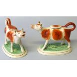 Two 19th century Staffordshire cow creamers, each with tail loop handle and lid, painted with