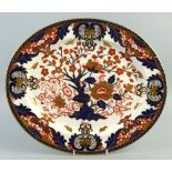 A Royal Crown Derby meat plate, of oval form painted in Imari colours with a central blossoming