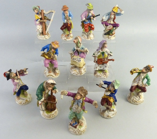 A set of twelve Dresden monkey musicians, comprising conductor, singer, drummer, four playing