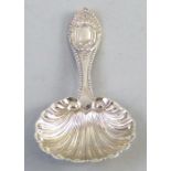 An Edwardian Caddy spoon, with shell bowl and ornate embossed handle, Sheffield 1902